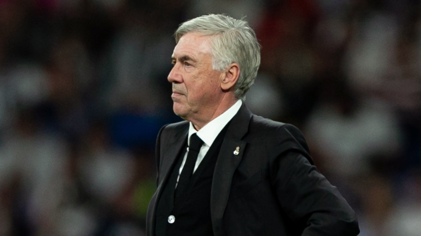 Carlo Ancelotti coaching on the field during a match