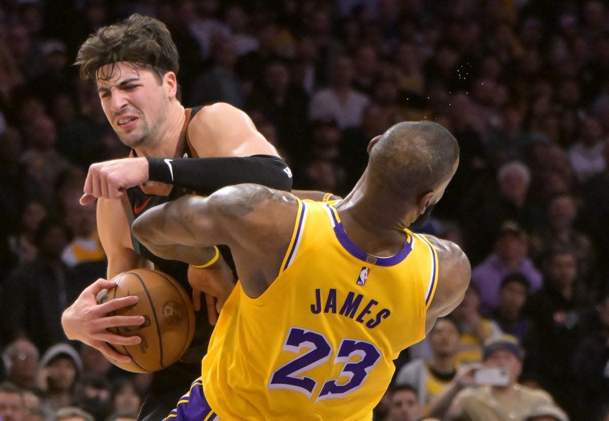 LeBron James drives to the basket in a dazzling display during the LA Lakers' game against the Denver Nuggets.